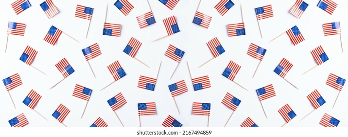 4th of July American Independence Day. Happy Independence Day. American flag decorations on white background. Flat lay, top view, copy space, banner
