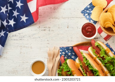 4th of July American Independence Day traditional picnic food. Hot dog with potato chips and cocktail, American flags and symbols of  USA Patriotic picnic holiday on white wooden background. Top view - Powered by Shutterstock