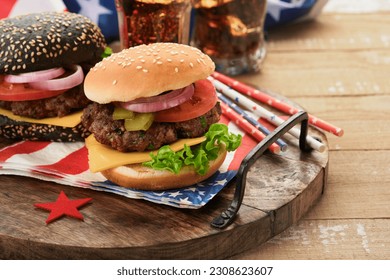 4th of July American Independence Day traditional picnic food. American Burger and cocktail, American flags and symbols of USA Patriotic picnic holiday on white wooden background. Top view - Powered by Shutterstock