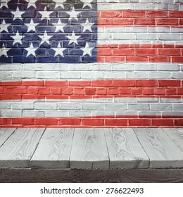4th Of July Background With Wooden Table Over USA Flag Painted On Brick Wall