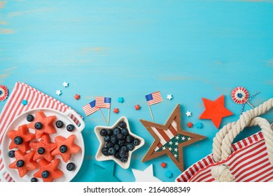 4th Of July Border Design, Independence Day Picnic Background With Fruit Salad, Beach Bag And Decorations. Top View, Flat Lay