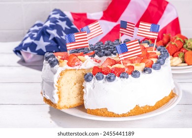  4th of July cake with flag and berries. Homemade Patriotic American flag striped vanilla cream sponge cake, Holiday Party summer dessert  - Powered by Shutterstock