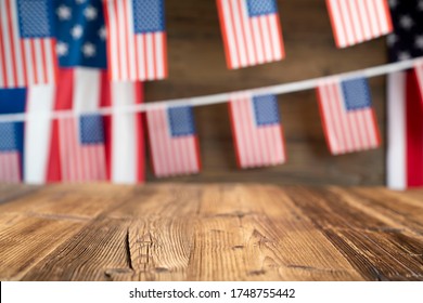 4th Of July Celebration. American Flag And Decorations. Burgers On Rustic Wooden Table. 