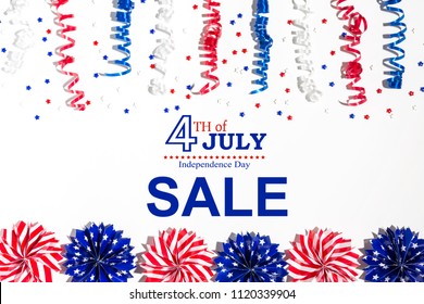 4th of July sale with holiday decorations on a white background flat lay