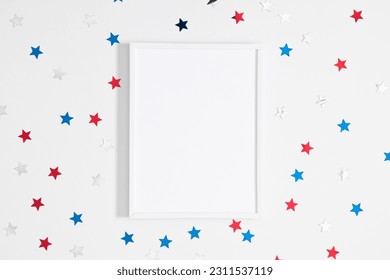 4th of July, USA Presidents Day, Independence Day, Memorial day, US election concept. Blank photo frame, star confetti on white background. Flat lay, top view, copy space, banner - Shutterstock ID 2311537119