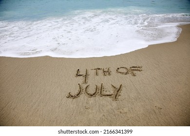 4th of July Words written in sand. Laguna Beach, California with 4th of July words in the sand. Pacific Ocean in Laguna Beach Ca. Fourth of July Text hand written into the sand in Laguna Beach CA.  - Shutterstock ID 2166341399