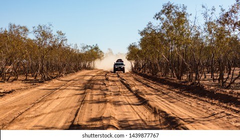 A 4wd Vehicle Approaches With A Large Dust Cloud Close Behind It From The Very Dusty Dirt Tracks Found In The Australian Outback.