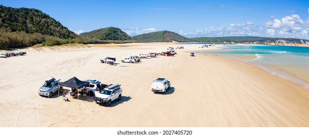 4WD Vehicles And Surfers At Double Island Point On A Sunny Day, Queensland Australia