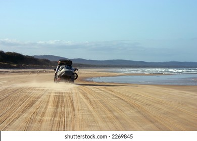 4WD Vehicule Driving On The Beach With A Trailer (Fraser Island, Australia)