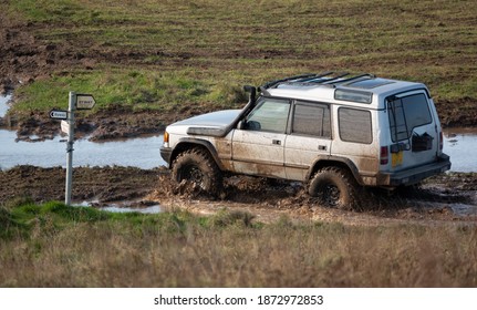 4x4 Land Rover Discovery Series II Off Roading, Wading In Deep Water And Slippery Mud