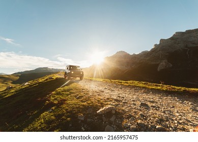 4x4 Off-road Car Driving Along A Mountain Track On A Sunny Day. Car Adventure Trip