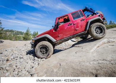 4x4 truck descending steep rock on the Rubicon Trail near Lake Tahoe, CA.