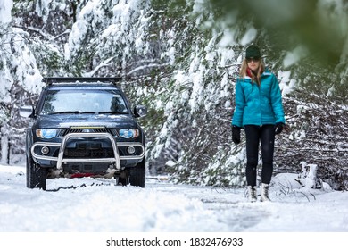 A 4x4 Ute In Snow Covered Pine Forest