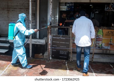 MUMBAI/INDIA–MAY 5, 2020:A Municipal Worker Sprays Disinfectant At A Liquor Store, After It Was Allowed To Open In All Except Containment Zones In Mumbai.