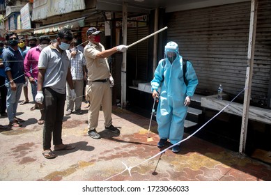 MUMBAI/INDIA–MAY 5, 2020:A Municipal Worker Sprays Disinfectant At A Liquor Store, After It Was Allowed To Open In All Except Containment Zones In Mumbai.