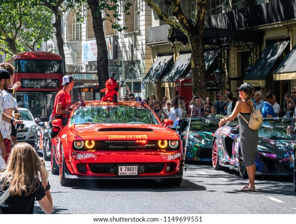 5 Aug 2018 - London, UK. Powerful red\
American Muscle, Dodge Challenger SRT Demon with Dubai license\
plates at Gumball Rally 3000 event.\
