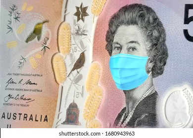 5$ Banknotes Of Australia With A Medical Mask. The Coronavirus Epidemic In Australia. The Impact Of The Coronavirus Epidemic On The Australian Economy. The Devaluation Of The Australian Currency