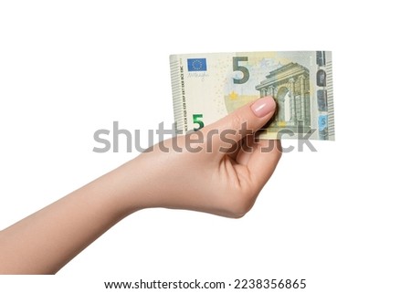 5 euro banknote in a female hand, isolate
