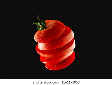 5 Flying Tomato Slices On A Black Background