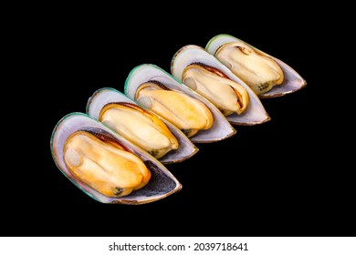 5 fresh peeled New Zealand mussels arranged isolated on a black background. popular seafood. Large New Zealand mussels prepared for cooking.