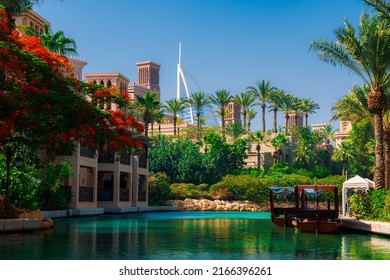 5 June 2022 - Dubai, UAE: Souk Madinat Jumeriah Waterway With Green Landscape And Burj Al-Arab