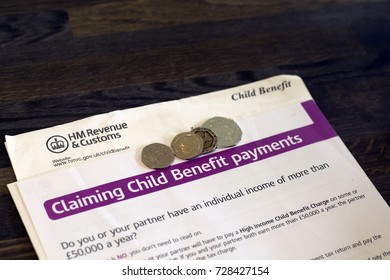 5 October 2017, Royston UK - Information Leaflets On Applying For Child Benefits, And Some Coins (Illustrative Editorial)