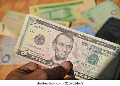 5 US Dollar Note. Portrait Of Abe Lincoln In Hand.