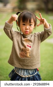 5 Year Old Asian Chinese Girl Making Faces