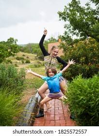 5 Year Old Boy And His 13 Year Old Sister Dancing In The Rain.