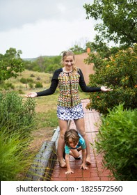 5 Year Old Boy And His 13 Year Old Sister Dancing In The Rain.