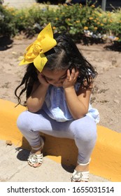 5 Year Old Girl Doing Tantrum, With Hands On Her Head