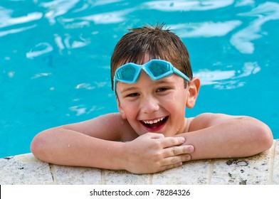 5 Year Old Kid Laughing In A Swimming Pool.