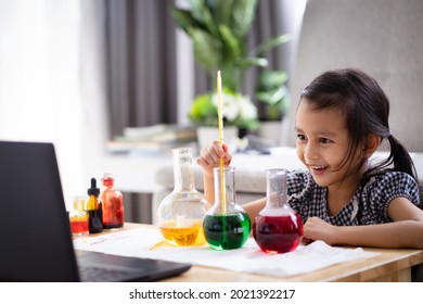 A 5 Years Old Asian Little Girl  Measuring The Temperature Of Hot And Cold Water For Easy Science Experimental Online Class, New Normal And Distance Learning, E-learning For Kid In Covid-19 Pandemic.