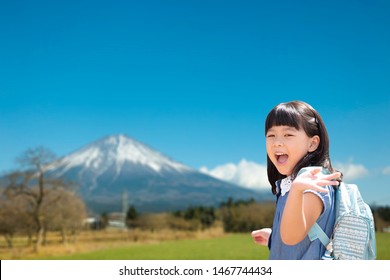 5 Years Old Happy Little Asian Kindergarten Student Girl Ready To Go To School And Waving Goodbye Or Say Hi Fuji Mountain Background.Japanese Kid Back To School Concept.