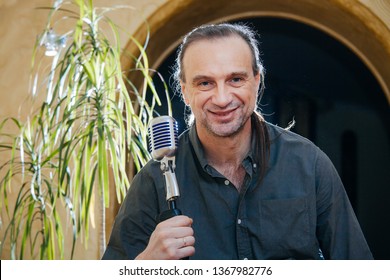 50 Plus Singer Men With Old School Microphone. Jazz Singer With Stylish Hairstyle Singing Karaoke. Closeup.
