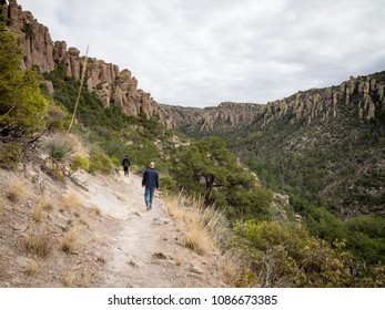 50 Year Old Man And 10 Year Old Boy, Hikers On Echo Canyon Trail, Chiricahua National Monument, Near Willcox, Cochise County, Arizona, USA