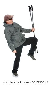 50 Year Old Man In A Tracksuit Waving His Nordic Walking Sticks-Isolated On White Background