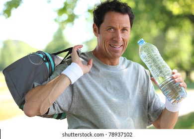 50 Years Old Man Drinking Man After He Did Sport