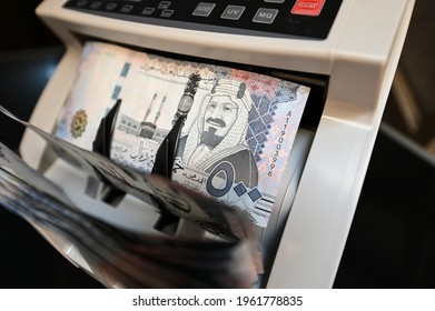 500 Saudi Riyal banknote paper on money counting machine - Shutterstock ID 1961778835