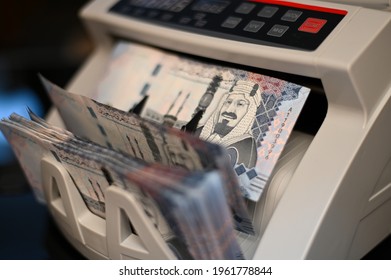 500 Saudi Riyal banknote paper on money counting machine - Shutterstock ID 1961778844