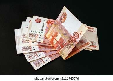 5000 rubles banknotes on black background. Russian cash money. - Shutterstock ID 2111945576