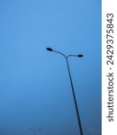 500px Photo ID: 1044554850 - Lamp post minimal photo at blue hour on highway