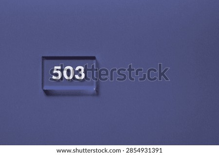 A 503 error code displayed on a wooden block against a purple background, symbolizing server downtime and service unavailability. Perfect for illustrating web hosting issues and IT infrastructure articles.
