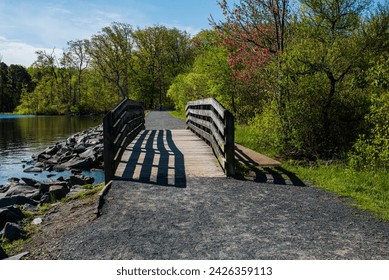 A 50mm photo of a wooden bridge taken in the morning at the Manasquan Reservoir.