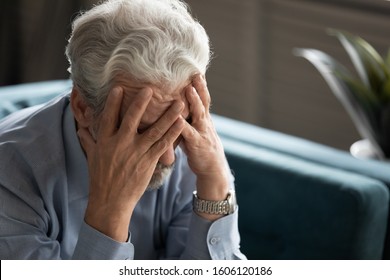 50s Man Hides His Face With Hands Looking Desperate Close Up, Aged Male Sit On Couch At Home Thinking Search Decision Feels Unwell, Mental Disorders Of Older People, Senile Diseases, Dementia Concept