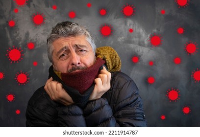 50-year-old Man Who Is Cold And Sick. He Wears A Scarf And A Big Jacket. Virus Icons Floating Around Him