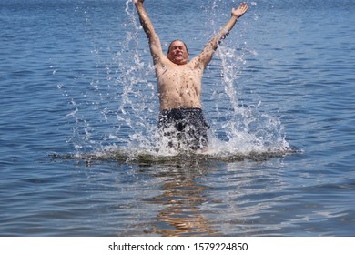 52 Year Old Man Jumping Inside The Bridal Pond, Playing In The Water