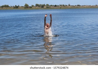 52 Year Old Man Jumping Inside The Bridal Pond, Playing In The Water