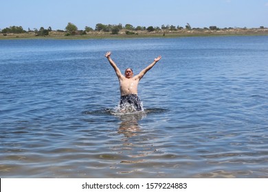 52 Year Old Man Jumping Inside The Bridal Pond, Playing In The Water