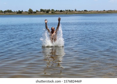 52 Years Old Man Jumping Into The Water In The Sailors Island In Southern Brazil